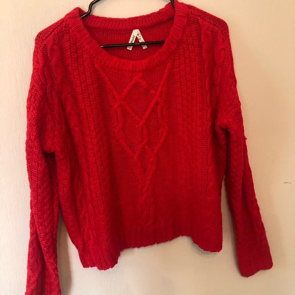 Bright red sweater